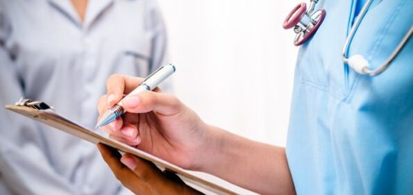 a doctor prescribes treatment for lower back pain